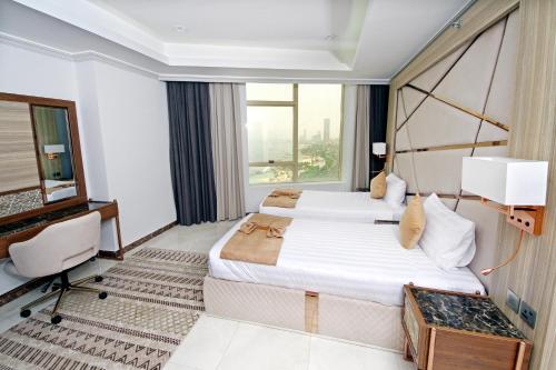 Postel nebo postele na pokoji v ubytování Seafront Luxury Suites Jeddah Corniche