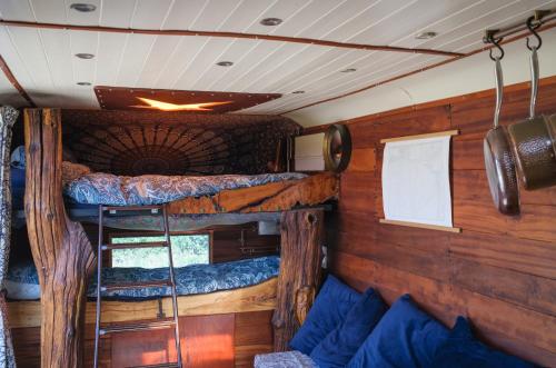 a bedroom with two bunk beds in a room at Get Away Hide Away in East Dereham