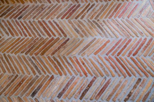 a close up picture of a brick sidewalk at La Casa di Ele in Matera