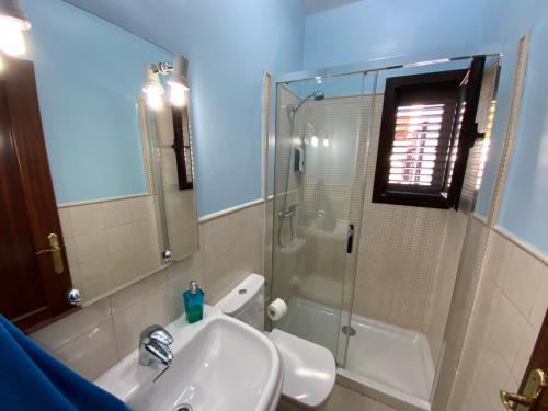 a bathroom with a sink and a shower at Villa Abuelo Paco - Private heated pool in Playa Blanca