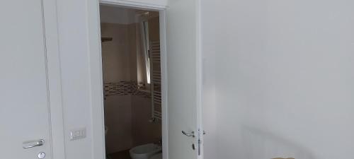 an open door to a bathroom with a toilet at La Bomboniera in Altamura