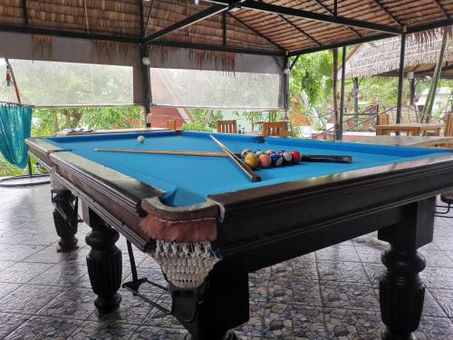 a pool table with balls on top of it at Harmony Naturist Resort Rawai Phuket 18yr minimum age only nudist nake d FKK in Rawai Beach