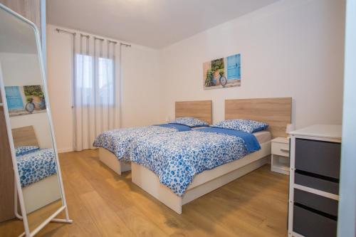 a bedroom with a bed and a ladder in it at Apartment Ivan 2 in Funtana