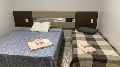 En eller flere senge i et værelse på Lagoa Quente Flat Service