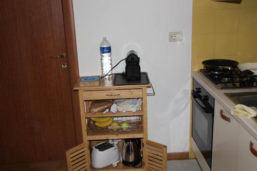 a small kitchen with a table and a stove at Casa Dalja in Abetone