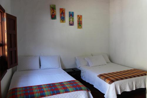 Postel nebo postele na pokoji v ubytování Casa Turistica Barichara