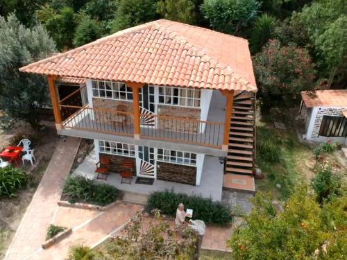 an overhead view of a house with an orange roof at Feliz Amanecer in Sáchica