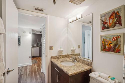 a bathroom with a sink and a mirror at Villa Madeira 505 - Premier in St. Pete Beach