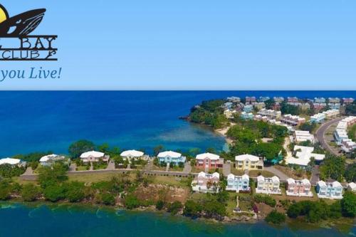 an aerial view of a resort on the water at Modern Luxury 2-bedroom 2.5-bathroom townhouse in Negril