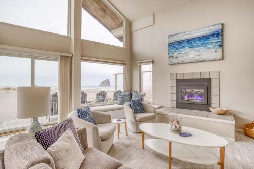 a living room with a couch and a fireplace at Pacific City Sand Dollar - Meredith Lodging in Pacific City