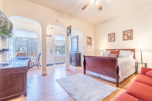 a bedroom with a bed and a living room at Rustic Studio walking distance to Downtown in Reno