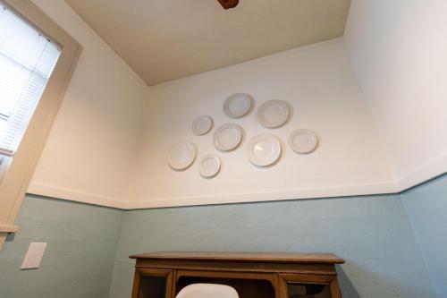 a bathroom with four plates on the wall at Historic Revival Midtown Memphis Duplex 64 Yes Pets Fast Wifi Free Parking in Memphis