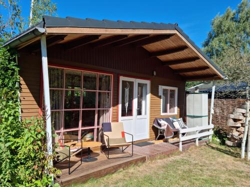Cozy Chalet in Geel located in an oasis of peace on the water
