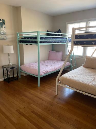 a bedroom with two bunk beds and a bed at You won't want to leave! in Huntsville