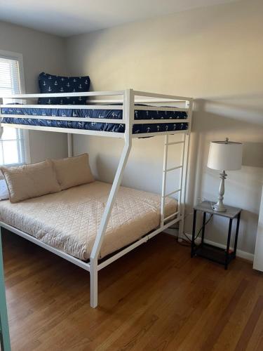 a bedroom with two bunk beds and a lamp at You won't want to leave! in Huntsville
