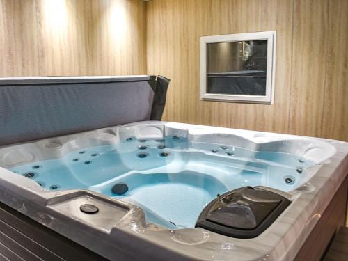 a jacuzzi tub in a room at Stonebank Cottage - Uk35686 in Hunwick