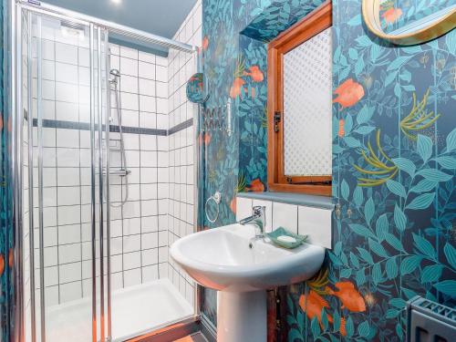 a bathroom with a sink and a shower at River Test View in Chilbolton