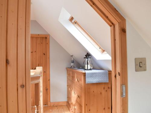 an attic room with a sink and a skylight at Viaduct View in Cullen