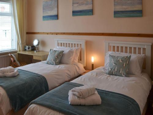 Katil atau katil-katil dalam bilik di Seaside Retreat