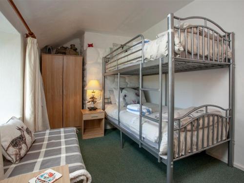 a bedroom with two bunk beds and a bed at Greenbank Farm in Saint Dennis
