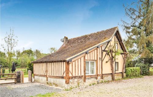 an old house in the middle of a field at Awesome Home In St Pierre En Auge in Vieux-Pont-En-Auge