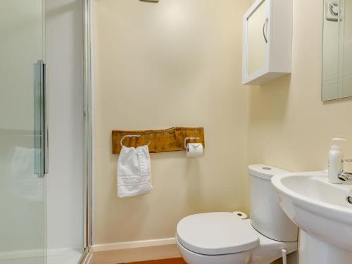 a bathroom with a shower and a toilet and a sink at Top Studio-uk35143 in Lincoln