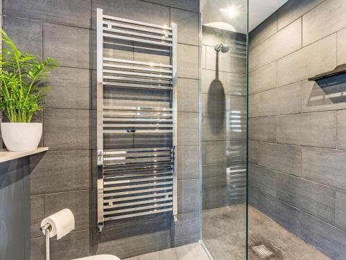 a bathroom with a shower with a glass door at Snowdrop Lodge -uk32959 in Molash