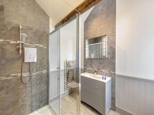 a bathroom with a shower and a sink at The Croft in Laneham