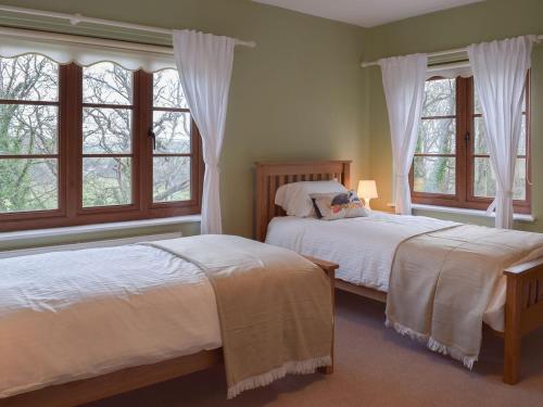 Castle Hill Cottage tesisinde bir odada yatak veya yataklar
