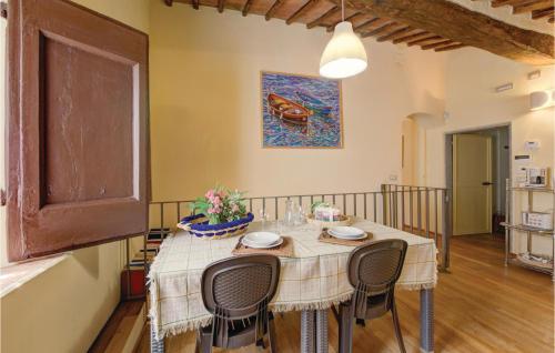 a dining room with a table and chairs at Casa I Gelsi in Tre Colli