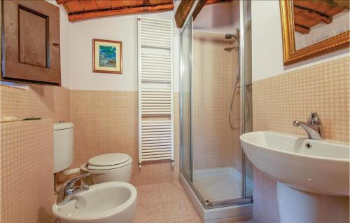 a bathroom with a toilet and a sink and a shower at Casa I Gelsi in Tre Colli
