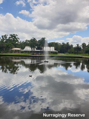 a pond with a fountain in the middle of it at Kaban Power 7 in Doonside