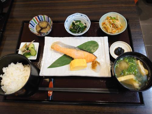a tray of food with sushi and rice on a table at The Edo Sakura in Tokyo