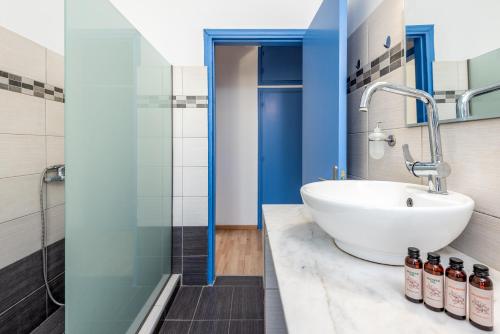 a bathroom with a sink and a shower at Rhodes Central Apartment in Rhodes Town