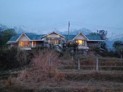a house sitting on top of a hill at Chinarchalet in Pālampur