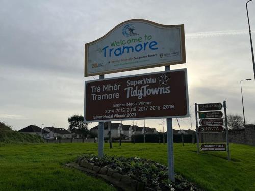a sign for a welcome to tramite sign in a field at Glencree Air in Kilmeaden