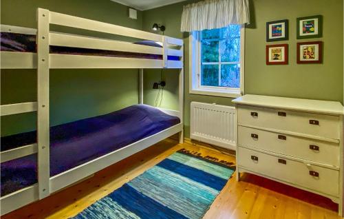 a bedroom with two bunk beds and a window at Gorgeous Home In lem With Wifi in Ålem