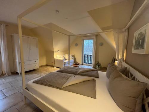 a bedroom with a large bed in a room at NaturApartments - Hideaway & Spa in Burg