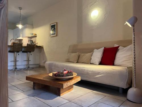 a living room with a couch and a table at NaturApartments - Hideaway & Spa in Burg