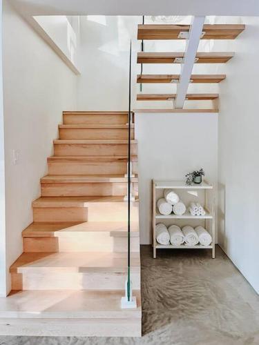 a staircase in a house with wooden floors at Okt Häus in Nordegg