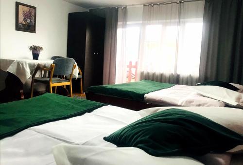 Un pat sau paturi într-o cameră la Apartament Sarco