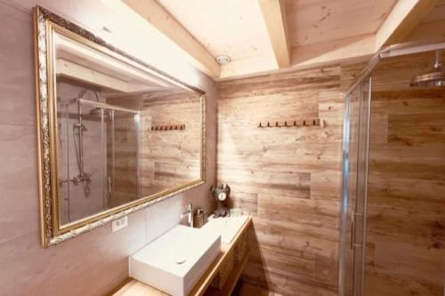 a bathroom with a sink and a mirror at Chic small new apartment up to 4 people, Pets allowed in Lens