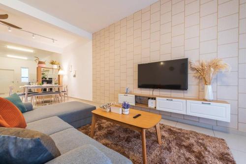 a living room with a couch and a tv at 15pax+Seremban stay n rest As316 民宿 in Siliau