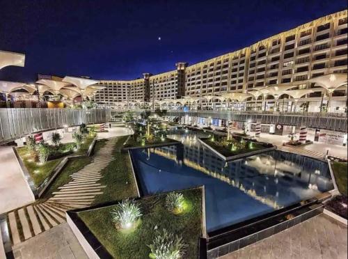 a view of the resort at night at Lofts by Elegant Hospitality in Cairo