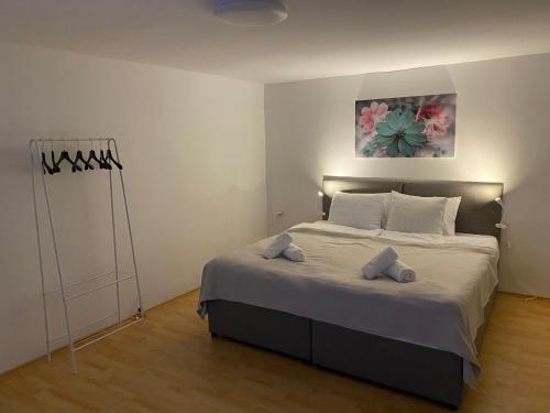 a bedroom with a bed with two pillows on it at FIA House in Skopje