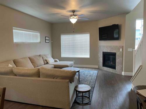 a living room with a couch and a fireplace at Family friendly 4-bdrm 3.5 bath w guest suite in Flagstaff