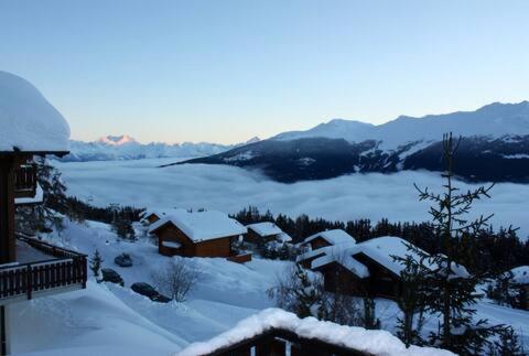 a view of a snow covered valley with a house at Le Grand Paradis - Les Collons near Verbier - 10 guests in Vex