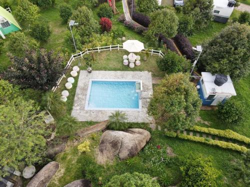 an aerial view of a swimming pool in a garden at Durian Ecolodge in Tampin