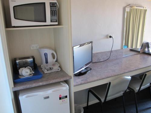 Kuchyň nebo kuchyňský kout v ubytování Merimbula Gardens Motel