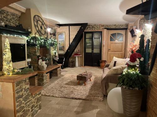 a living room with a couch and a fireplace at IL PICCOLO PARADISO in Seravezza